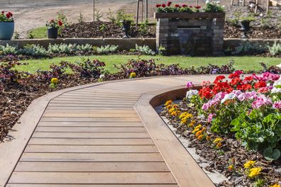 front yard garden with path and flower beds