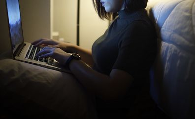 Woman using computer online