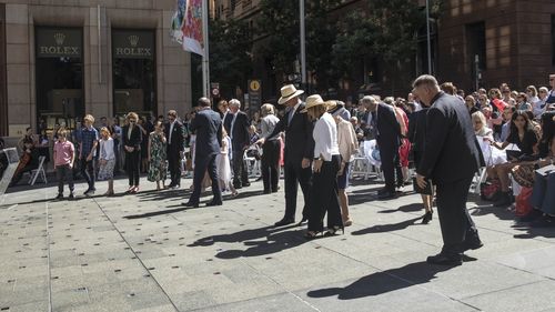 Dignitaries, family and close friends inspect the memorial honouring Katrina Dawson and Tori Johnson. (AAP) 