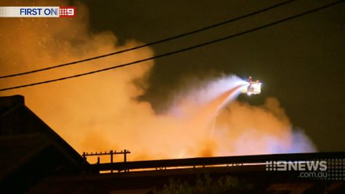 Firefighters managed to stop the fire before it destroyed more historic train carriages. (9NEWS)