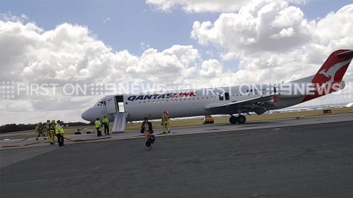 The plane was evacuated around 11.36am (9NEWS)