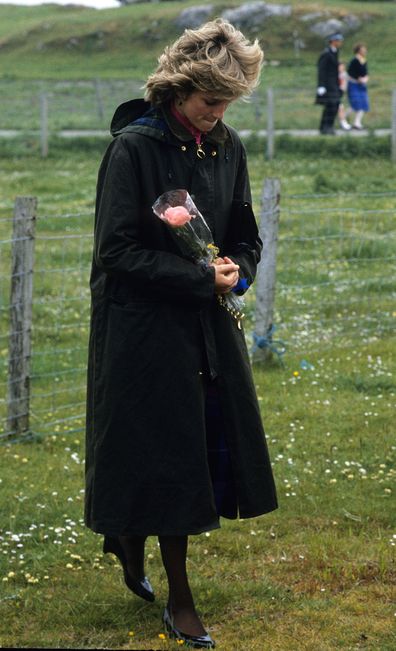 Diana, Princess of Wales, wearing a Barbour waxed jacket, holds a bouquet during a visit to Lochmaddy on July 4, 1985 in the Outer Hebrides, Scotland 