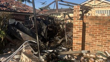 An explosion destroyed a garage in East Hills, Sydney.