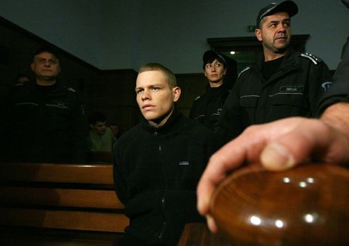 Bulgarian policemen stand guard around Australian Jock Palfreeman before the start of a 2008 hearing of his appeal case in the Court of Appeal in the Bulgarian capital Sofia.