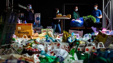 Volunteers organise and deliver food to public housing towers on July 07, 2020 in Melbourne, Australia.