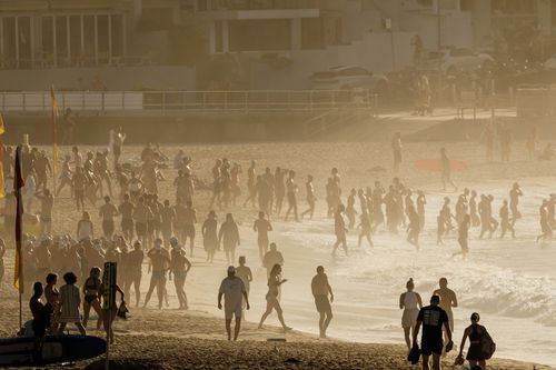 SYDNEY, AUSTRALIA - NOVEMBER 27: A packed Bondi Beach at sunrise on November 27, 2024 in Sydney, Australia. Some Australians experienced temperatures of 40 degrees plus last weekend.