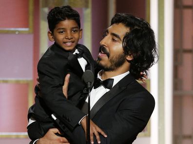 74th ANNUAL GOLDEN GLOBE AWARDS -- Pictured: Sunny Pawar, Dev Patel, Presenters, at the 74th Annual Golden Globe Awards held at the Beverly Hilton Hotel on January 8, 2017 -- (Photo by: Paul Drinkwater/NBC)