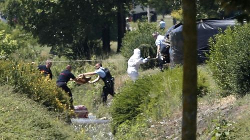 Emergency personnel work at the scene of a suspected Islamist attack in southern France. (AAP)