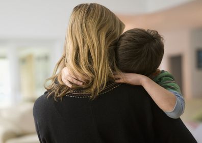 Woman hugging male child