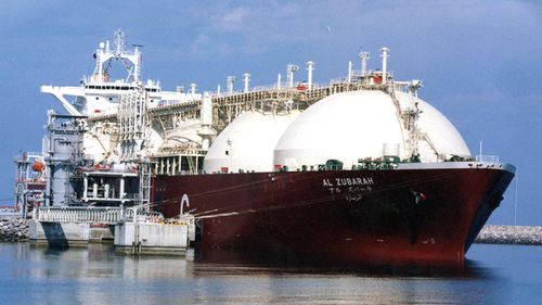 Qatari Liquid Natural Gas (LNG) tanker ship being loaded up with LNG at Raslaffans Sea Port, northern Qatar. (AAP)