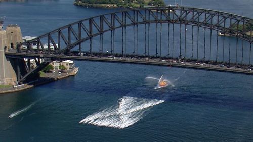 Anti-violence charity White Ribbon staged a flotilla with 50 jetskis on Sydney Harbour this morning.