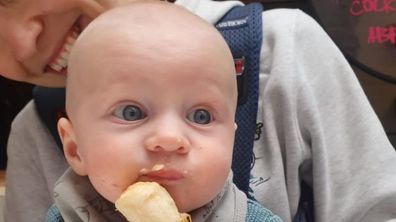 Baby Sarah enjoying some solid food