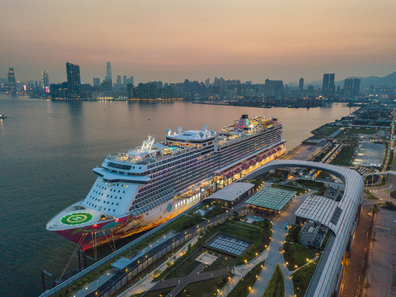 The Genting Dream cruise ship is moored at the Kai Tak Cruise terminal in this panorama by drone in Hong Kong, China, 23 Jul 2021. Hong Kong is about to allow fully vaccinated ''cruises to nowhere'' starting in August.