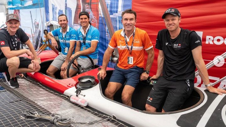Pat Cash (second from right) gets familiar with a SailGP vessel on board with Switzerland&#x27;s Aussie sailing star Nathan Outteridge (far right).
