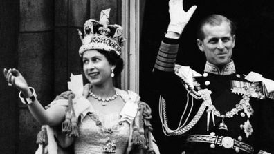 Queen Elizabeth II  and Prince Philip wave to the crowd after her Coronation