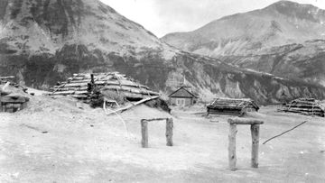 FILE - This June 1912 file photo provided by the U.S. Geological Survey shows ash drifts around Katmai village&#x27;s then-new Russian Orthodox church after the eruption of Novarupta Volcano in Katmai National Park and Preserve in Alaska. An unusual alert was issued by volcano scientists Wednesday, Nov. 17, 2021, warning that an ash cloud was headed toward Alaska&#x27;s Kodiak Island. What made this unusual is that the ash is not from a current eruption, not even one from this century. 