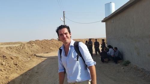 Reporter Peter Stefanovic pictured at a PKK compound south of Kirkuk, in Iraq. (9NEWS)