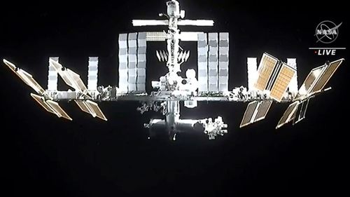 The International Space Station is seen as astronauts in the SpaceX Dragon capsule undock.