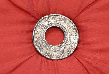 Colonial NSW's holey dollar was made by punching a hole through which coin?