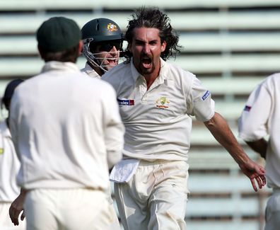 Jason Gillespie of Australia celebrates the wicket of Sachin Tendulkar of India during day two of the Fourth Test between India and Australia at Wankhede Stadium on November 4, 2004 in Mumbai, India. (Photo by Hamish Blair/Getty Images)