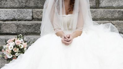 Bride sad sitting on steps