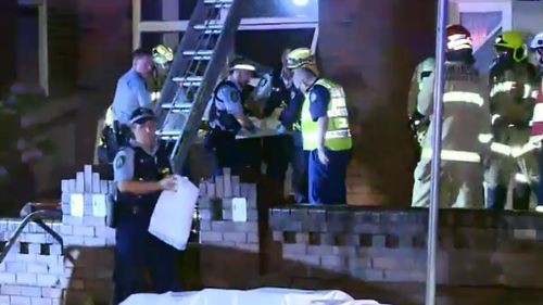 Firefighters were called to a burning Ashfield unit. (9NEWS)
