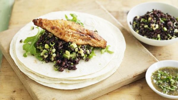 Fish tortilla with avocado rice and rocket