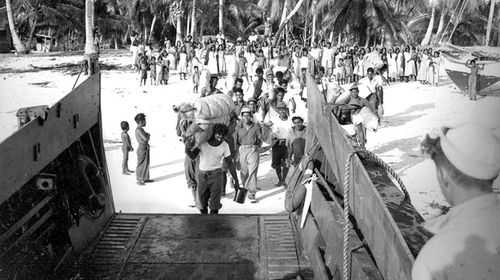 According to the Navy's caption, "Natives going aboard LCM [Landing craft mechanized]." (National Security Archive) 