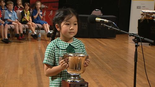 Grace Du with her spelling champion's cup.