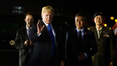 The US President's trade adviser fired off the anti-Trudeau message as Donald Trump arrived in Singapore for his summit with Kim Jong Un of North Korea. Picture: AP