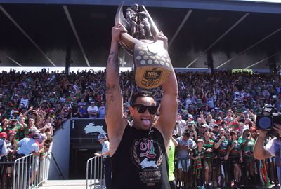 Sutton lifts the NRL trophy to the roar of Bunnies fans.