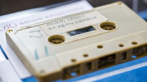 A view of a cassette with the recording of four Danish schoolboys' interviews with John Lennon and Yoko Ono during the famous couple's winter stay in Thy, in Jutland, Denmark, in 1970, on display at Bruun Rasmussen Auction House in Copenhagen Friday Sept. 24, 2021. Half a century ago, four Danish teenagers interviewed John Lennon for their school paper.
