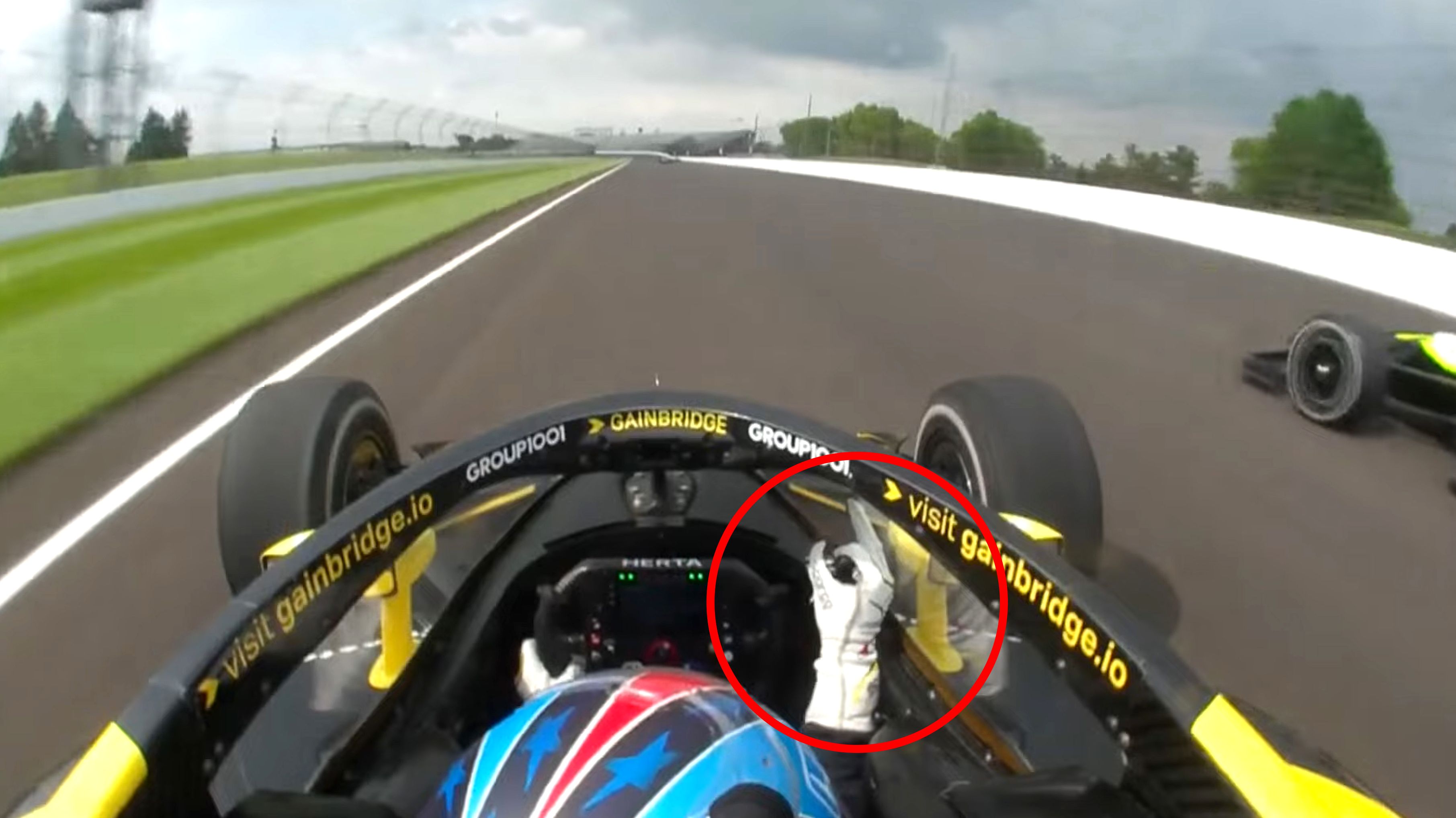 Colton Herta pokes his middle finger at Christian Rasmussen in practice at the Indianapolis 500.