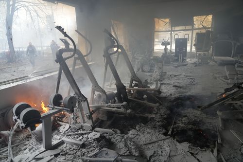 A view of smoke from inside a damaged gym following shelling in Kyiv, Ukraine, Wednesday, March 2, 2022. 