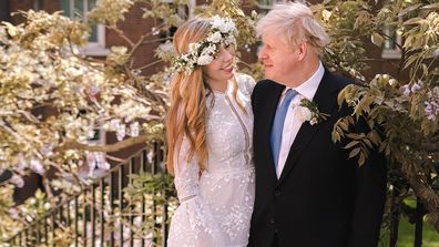 British Prime Minister Boris Johnson poses with his wife Carrie Johnson in the garden of 10 Downing Street following their wedding at Westminster Cathedral, May 29, 2021