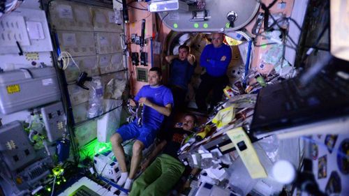 Astronauts watch 'The Martian' movie at the space station earlier this year. (Twitter/@StationCDRKelly)