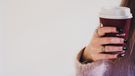 Woman holding coffee cup