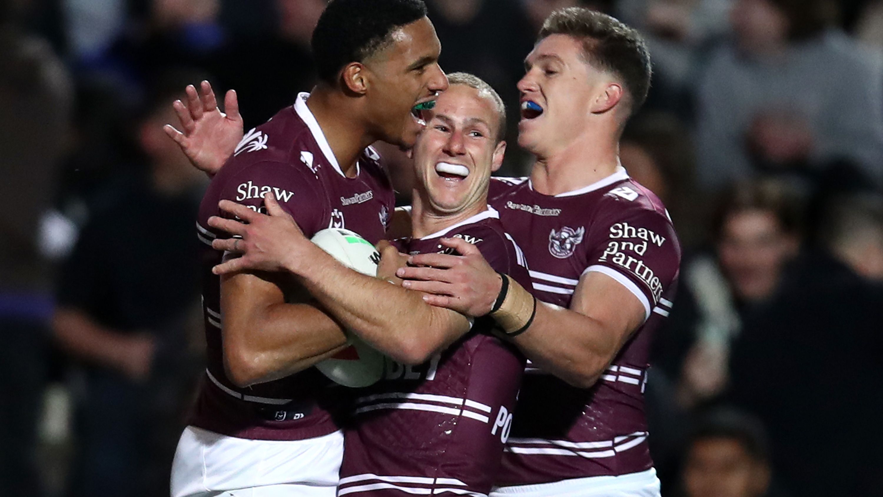 Jason Saab of the Sea Eagles celebrates with team mates after scoring a try during the round 15 NRL match between Manly Sea Eagles and Dolphins at 4 Pines Park on June 09, 2023 in Sydney, Australia. (Photo by Jason McCawley/Getty Images)