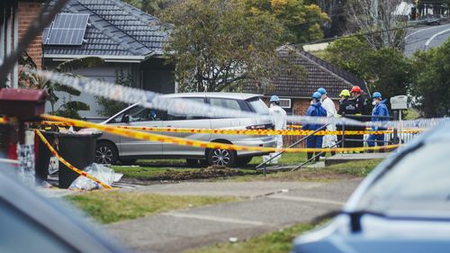 Police and forensic crews at the scene of the Lalor Park blaze.