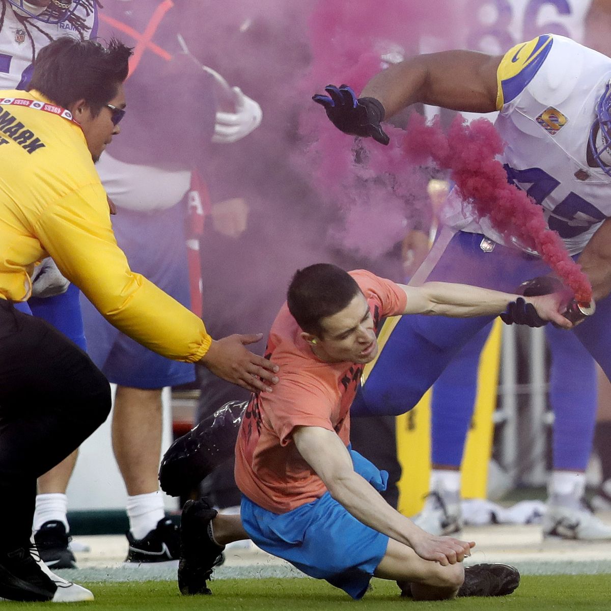 A fan ran on the field with a pink smoke bomb and Bobby Wagner