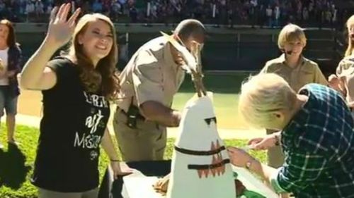 Bindi waves to fans in the 'Crocoseum'. (9NEWS)