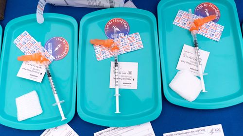 Pfizer COVID-19 vaccine doses are prepared for members of the community 12 years and up, at a clinic held by Community of Hope, outside the Washington School for Girls in southeast Washington.