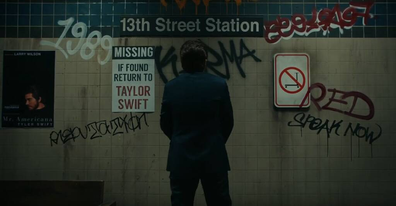 Taylor Swift's album names are graffitied on the wall.