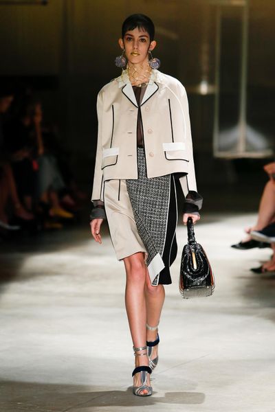 At the heart of Miuccia Prada's spring/summer collection were boxy jackets and midi skirts decorated in stripes, embellishments and mannish tweeds.