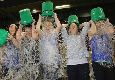 Participants sign up to take part in the World Record Ice Bucket Challenge at Etihad Stadium on August 22, 2014 in Melbourne, Australia.  The Ice Bucket Challenge is the social media phenomenon which is helping raise awareness and money for sufferers of Motor Neurone Disease.