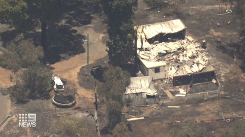 A family home has been destroyed and at least three more damaged after a bushfire jumped containment lines south-west Western Australia.Some locals were injured during the shock flare up.
