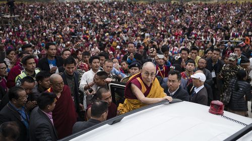 Huge crowds turned out for the 81-year-old monk on what may be his last ever visit to Tawang. (AAP)