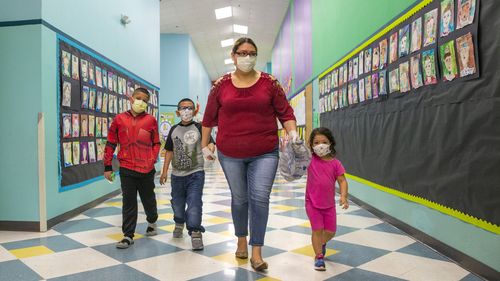 Children in the United States wear masks while at school.