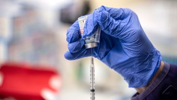 A nurse fills up a syringe with the Moderna Covid-19 vaccine in March 2021 in San Antonio, Texas. Vaccine maker Moderna announced on June 10 positive late-stage trial results for its Covid/flu combination vaccine it calls mRNA-1083.