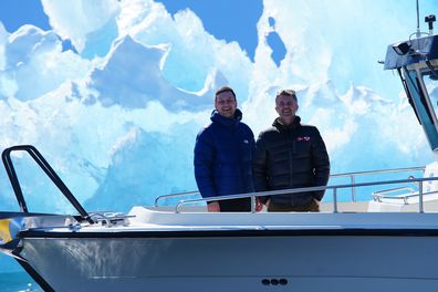 Denmark's King Frederik, right, and Greenland's head of government Jens-Frederik Nielsen in front of a iceberg during a boat trip in Nuuk fjord, in Greenland, Tuesday April 29, 2025. (Ida Marie Odhaard/Ritzau Scanpix via AP)